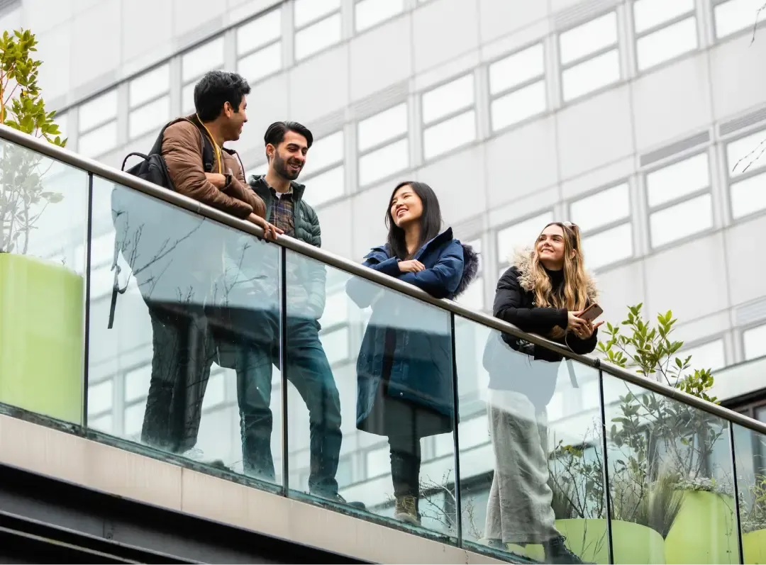 University of Plymouth , student chatting at outside campus 