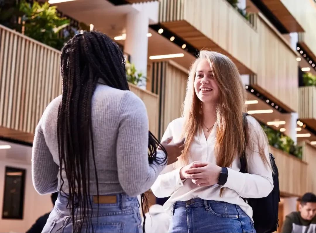 Sheffield Hallam University, student chatting with friend